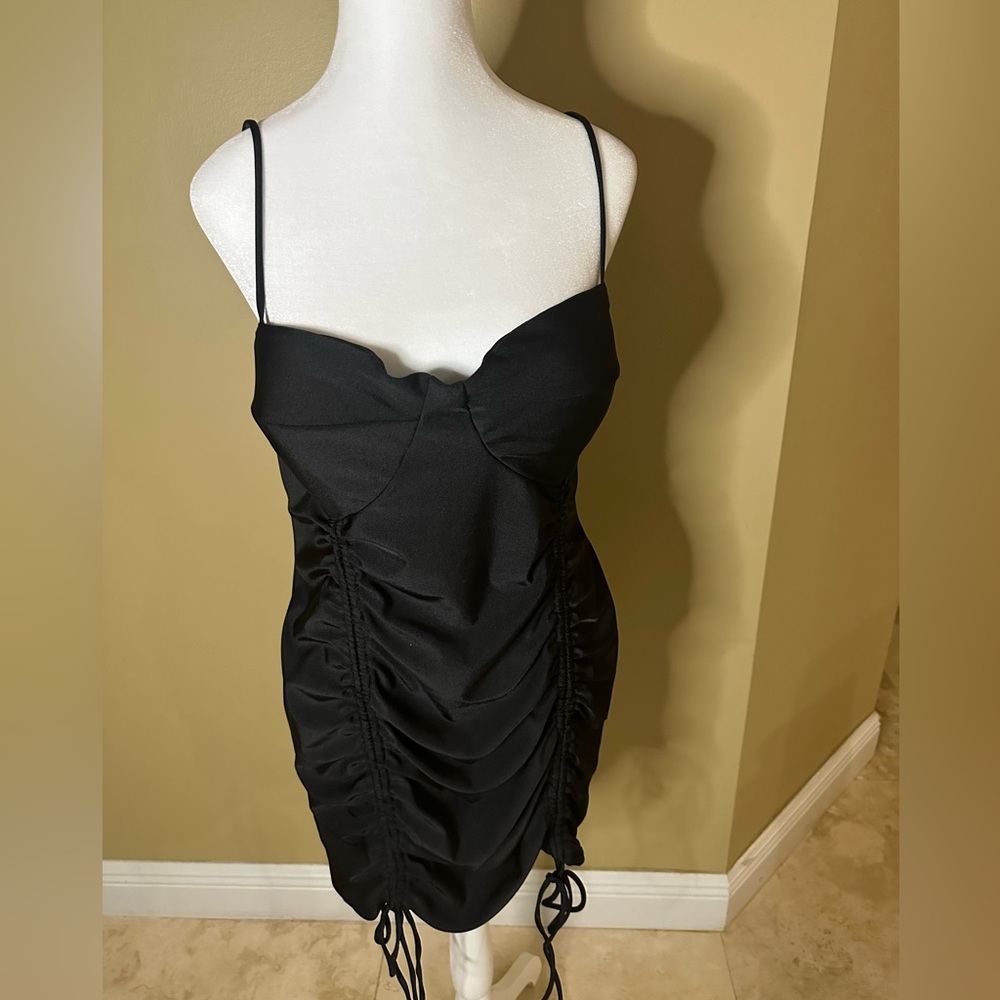 Black womens spandex dress. Great for night out. Material stretches.
